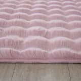 Close-up van zacht roze tapijt met golvend patroon 3D effect
