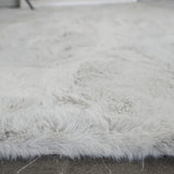 Zijkant detail KNUFFEL vloerkleed - 30 mm dikke pool en fluffy afwerking