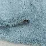 Zijaanzicht Blauwe hoogpolig fluffy shaggy vloerkleed