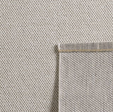 Loom 4300 Cream/Creme Laagpolig Duurzaam Geweven Vloerkleed Effen Binnen/Buiten Tapijt in een sfeervolle woonkamer
