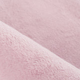 Detailfoto van roze superzachte hoogpolig pluche vloerkleed