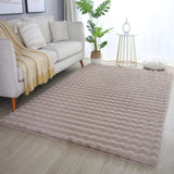 zacht beige tapijt met golvend patroon 3D effect in een woonkamer 